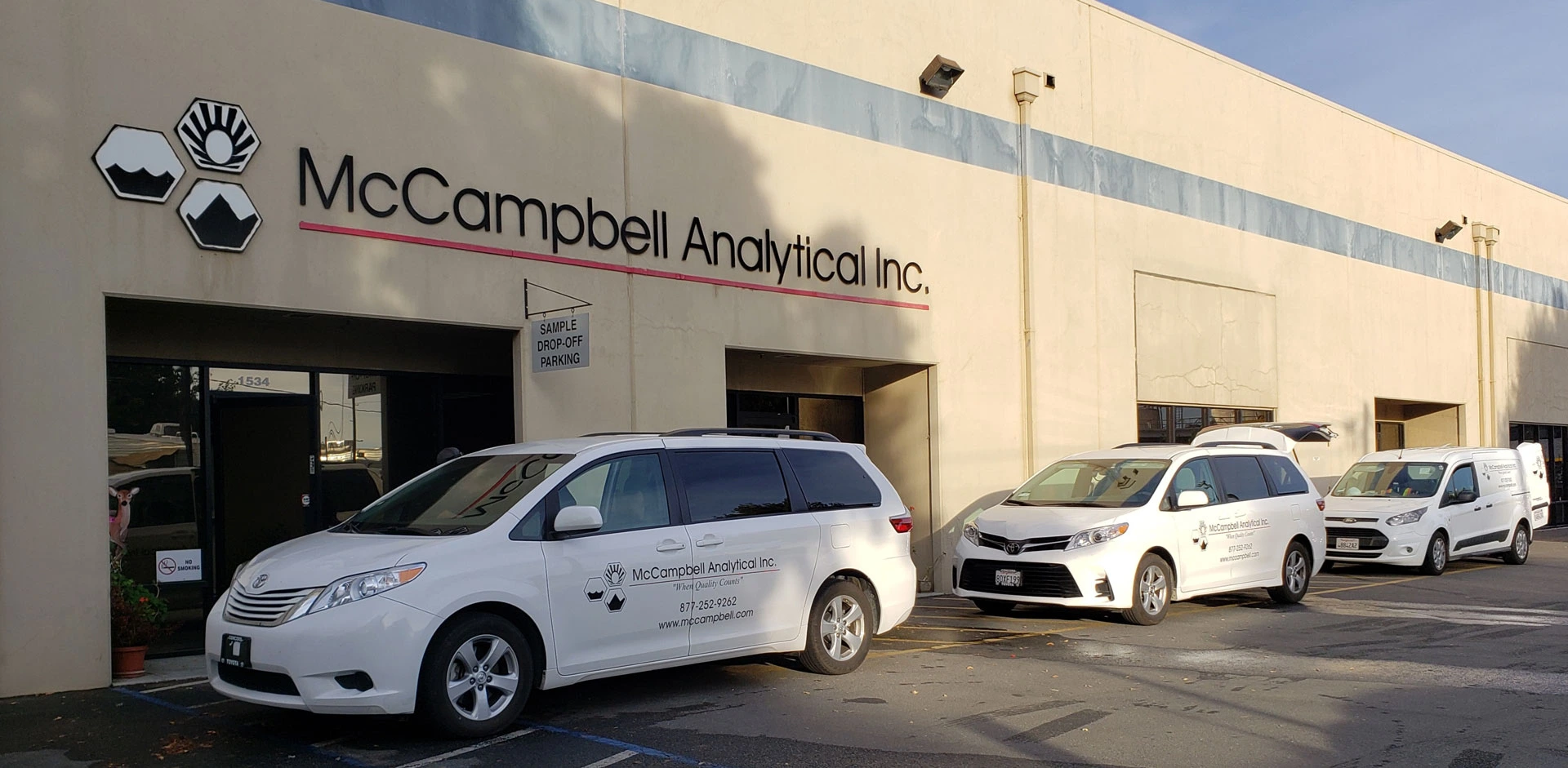 Front of Mccampbell Analytical with vans